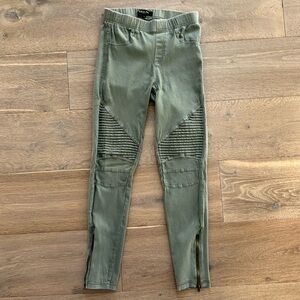 Army green leggings with zip ankles and textured front